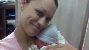 Mother holding twin baby