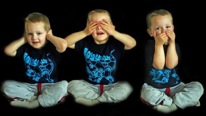 triplets covering ears, eyes, mouth