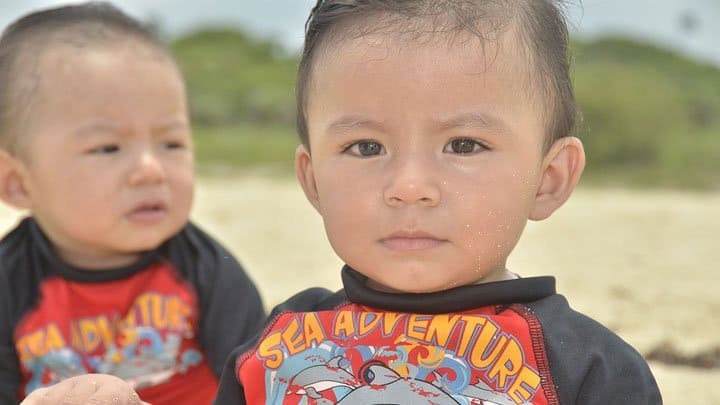twin boys on beach