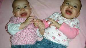 Twin girls laughing
